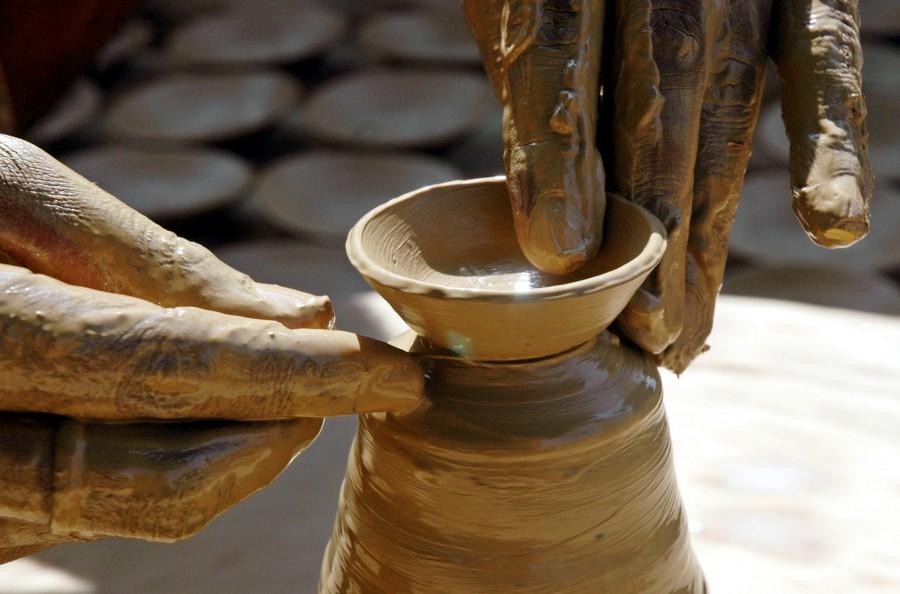 An Indian potter makes a clay lamp for the upcoming Hindu festival of Deepavali in northern Indian city of Allahabad. Diwali 2017,Happy Diwali 2017,Happy Diwali,festival of light,significance of festival of lights,People gears for festival of light,People gears for Diwali,People gears for Diwali 2017,happy diwali,Diwali quotes,Diwali wishes,Diwali greetings