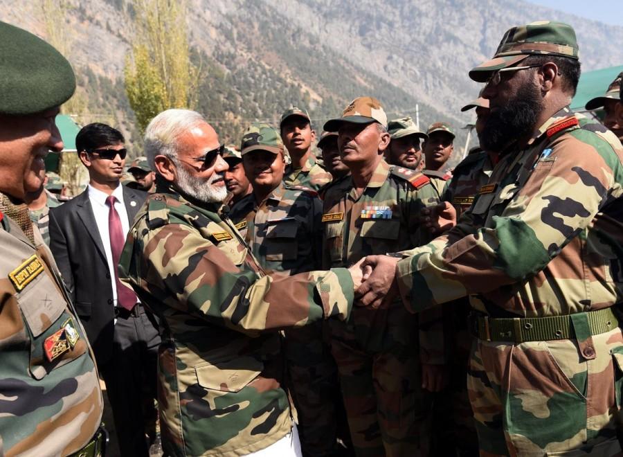 Prime Minister Narendra Modi on Thursday arrived in the border town of Gurez to celebrate Diwali with the soldiers protecting the country's borders. PM Narendra Modi,Narendra Modi,Narendra Modi celebrates Diwali,Modi celebrates Diwali,Narendra Modi celebrates Diwali with soldiers