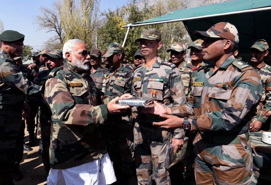 Official reports said in summer capital Srinagar that the Prime Minister arrived at the Dawar Brigade headquarters of the Indian Army in Gurez border town on Thursday to celebrate Diwali with the soldiers protecting the Line of Control (LoC). PM Narendra Modi,Narendra Modi,Narendra Modi celebrates Diwali,Modi celebrates Diwali,Narendra Modi celebrates Diwali with soldiers