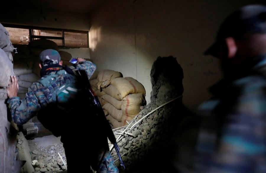Fighters of Syrian Democratic Forces inspect a bunker of the Islamic State militants under the stadium in Raqqa. Islamic State bunker,Islamic State,Raqqa,Syrian Democratic Forces,Syrian Democratic Forces (SDF),Islamic State militants