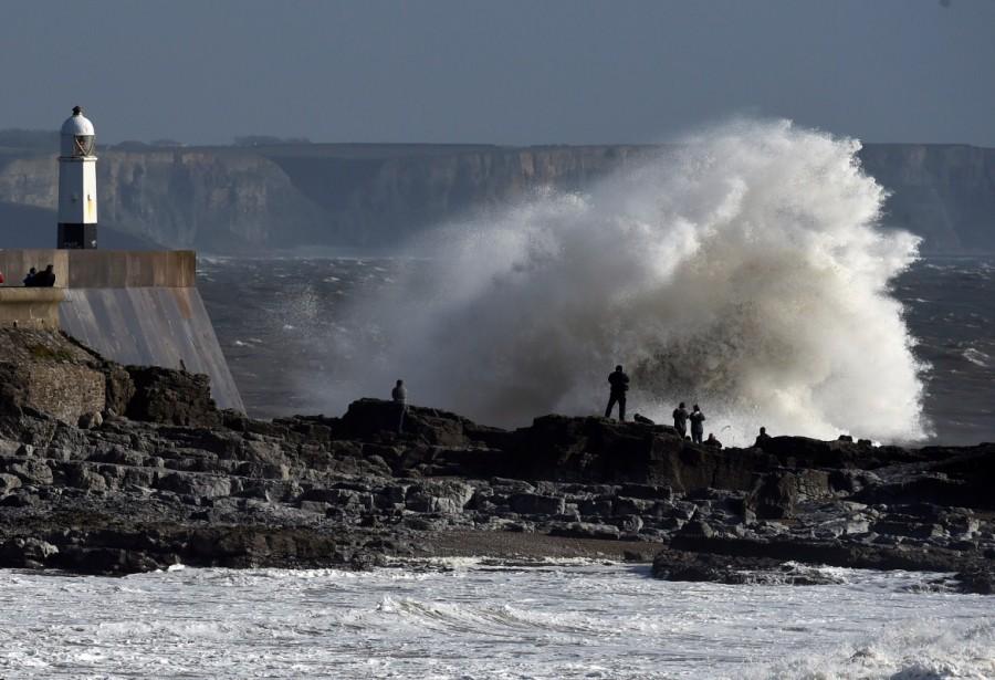 Waves crash over the lighthouse as storm Ophelia approaches Porthcawl, Wales. Storm Ophelia,Tropical Storm Ophelia,Tropical Storm Ophelia hits Ireland,Tropical Storm Ophelia hits UK