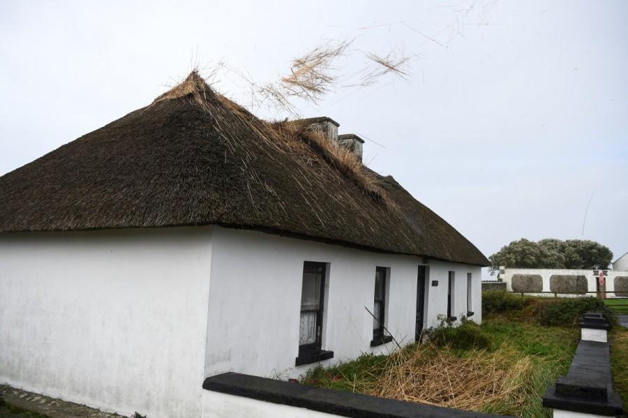 The roof of a thatched cottage starts to blow off as storm Ophelia hits the County Clare village of Spanish Point, Ireland. Storm Ophelia,Tropical Storm Ophelia,Tropical Storm Ophelia hits Ireland,Tropical Storm Ophelia hits UK
