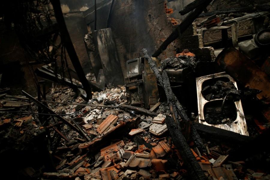 A burnt house is seen following a forest fire in Vila Nova, near Vouzela, Portugal, October 16, 2017. Deadly wildfires,Deadly wildfires in Portugal,Deadly wildfires in Spain,Hurricane Ophelia