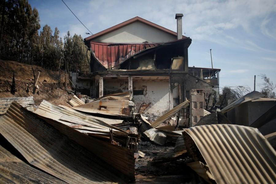 A burnt house is seen after a forest fire in Lagares, near Santa Comba Dao, Portugal October 17, 2017. Deadly wildfires,Deadly wildfires in Portugal,Deadly wildfires in Spain,Hurricane Ophelia