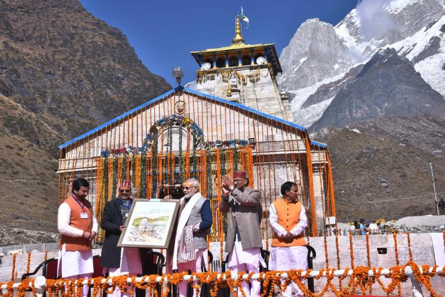 Prime Minister Narendra Modi on Friday visited the Himalayan shrine of Kedarnath ahead of its closure for the next six months. This is his second visit to the shrine this year. Modi was accompanied by Uttarakhand Chief Minister Trivendra Singh Rawat and other state and central government officials. The priests at the Lord Shiva shrine and the locals welcomed the Prime Minister. The temple was decked up with yellow flowers. Narendra Modi,Narendra Modi visits Kedarnath,Kedarnath,Prime Minister Narendra Modi,PM Narendra Modi
