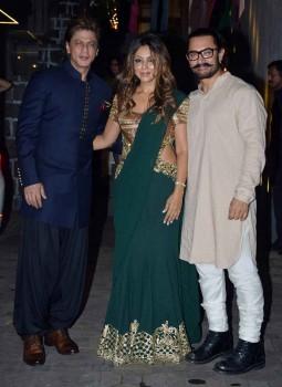 Aamir Khan poses with Shah Rukh Khan and Gauri Khan.