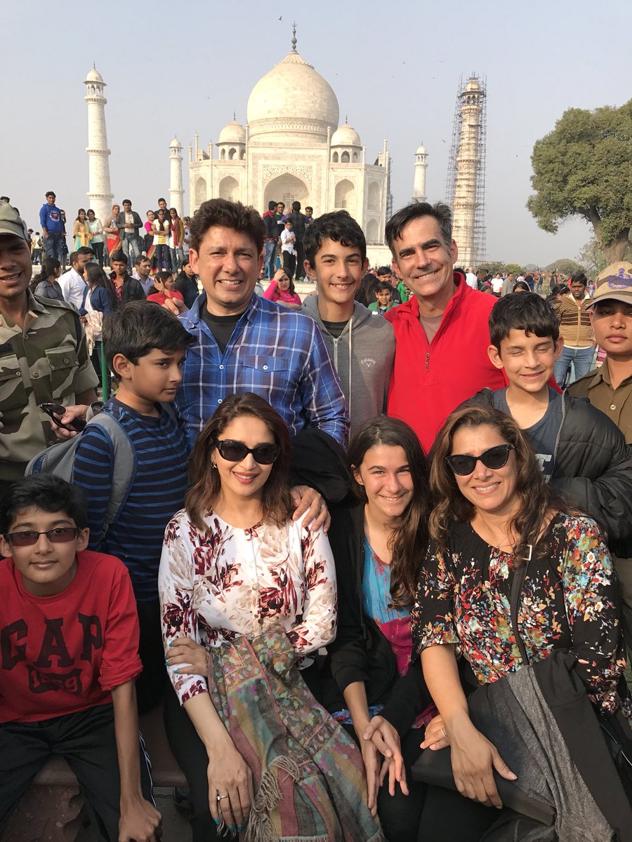 Madhuri Dixit-Nene visited Taj Mahal with her family. The actress says her "love affair with India goes on". Madhuri took to Twitter on Saturday to share a photograph in which the couple along with their two sons Arin and Rayaan, and other members of the family can be seen posing in front of the 17th century marble mausoleum. The actress, who earlier this week celebrated her 18th marriage anniversary with husband Shriram Nene, also shared a throwback image of her husband and his sister in front of Taj Mahal. "Loved this shot of Ram and his sister. Now flash forward. The love affair with India goes on. Jai Hind," Madhuri wrote in the caption. Madhuri Dixit,actress Madhuri Dixit,Madhuri Dixit visits Taj Mahal,Madhuri Dixit at Taj Mahal,Madhuri Dixit with family