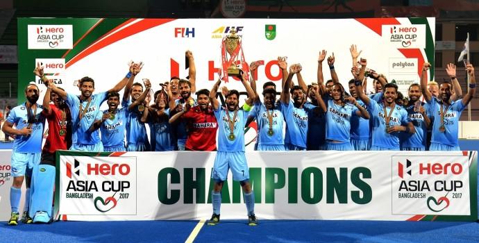 Team members of India celebrate with the trophy after the awarding ceremony for Asia Cup Hockey 2017 in Dhaka, Bangladesh, on Oct. 22, 2017. India clinched the title for the third time by defeating Malaysia with 2-1 in the final.