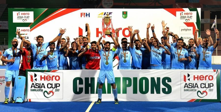 Team members of India celebrate with the trophy after the awarding ceremony for Asia Cup Hockey 2017 in Dhaka, Bangladesh, on Oct. 22, 2017. India clinched the title for the third time by defeating Malaysia with 2-1 in the final. India beat Malaysia,India vs Malaysia,Hockey Asia Cup,Asia Cup title,Asia Cup title 2017