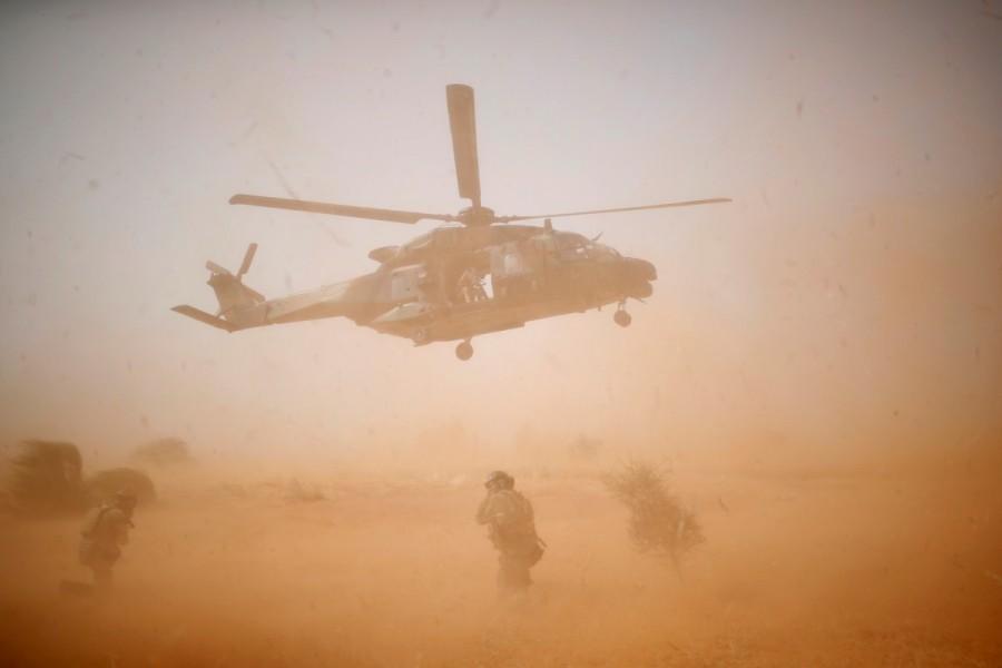 A NH 90 Caiman military helicopter takes-off during the regional anti-insurgent Operation Barkhane in Inaloglog, Mali. France intervened in Mali to ward off an offensive by Islamist militants that began in 2012, and 4,000 of its troops remain in the region as part of Operation Barkhane where they work alongside 10,000 U.N. peacekeepers in Mali. French forces,French forces fight,Mali,Islamist militants,Operation Barkhane