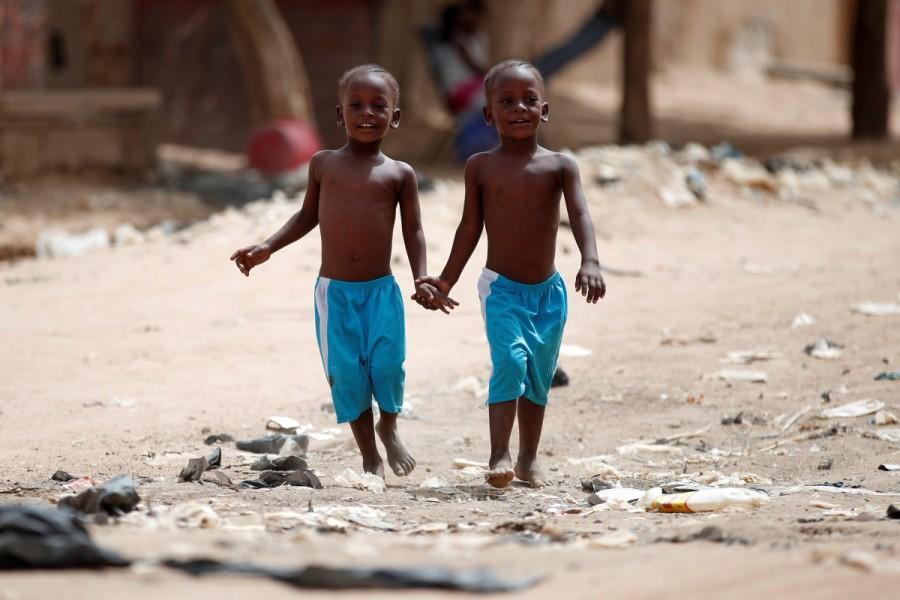 Children hold hands as they walk in the street in Gao, Mali. French forces,French forces fight,Mali,Islamist militants,Operation Barkhane
