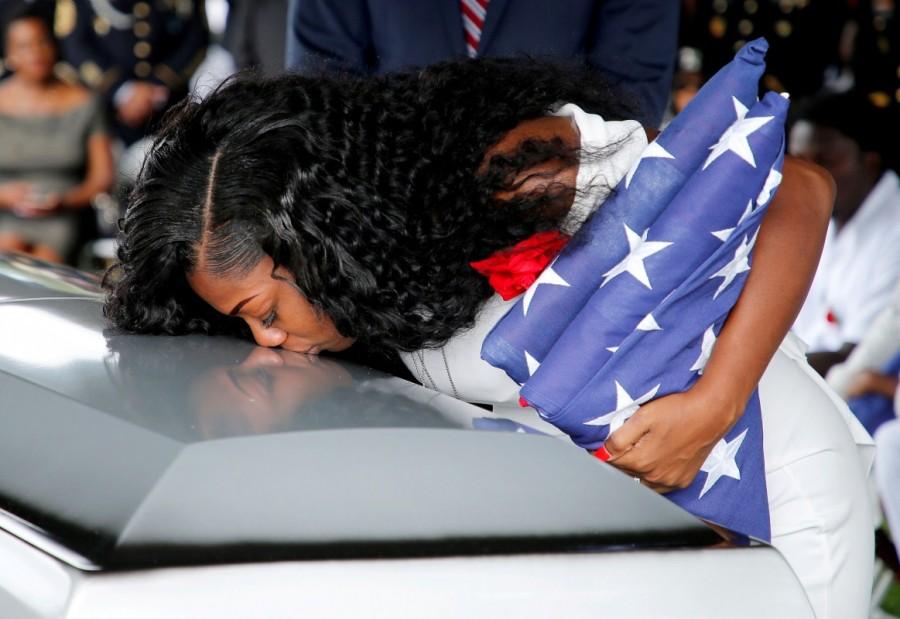 Myeshia Johnson, wife of U.S. Army Sergeant La David Johnson, who was among four special forces soldiers killed in Niger, kisses his coffin at a graveside service in Hollywood, Florida. Sgt. La David Johnson,Sgt. La David Johnson Funeral,Sgt. La David Johnson Funeral pics,Sgt. La David Johnson Funeral images,Sgt. La David Johnson Funeral stills,Sgt. La David Johnson Funeral pictures,Sgt. La David Johnson Funeral photos