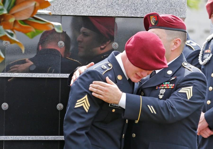 An unidentified honor guard member reacts after the graveside service. Sgt. La David Johnson,Sgt. La David Johnson Funeral,Sgt. La David Johnson Funeral pics,Sgt. La David Johnson Funeral images,Sgt. La David Johnson Funeral stills,Sgt. La David Johnson Funeral pictures,Sgt. La David Johnson Funeral photos