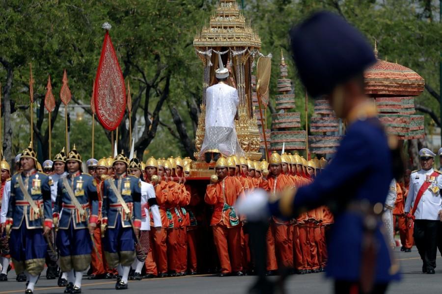 A royal palanquin is carried by soldiers during a procession to transfer the royal relics and ashes of Thailand's late King Bhumibol Adulyadej from the crematorium to the Grand Palace in Bangkok. Thai king,King Bhumibol,Bangkok Grand Palace,Royal cremation for Thai king