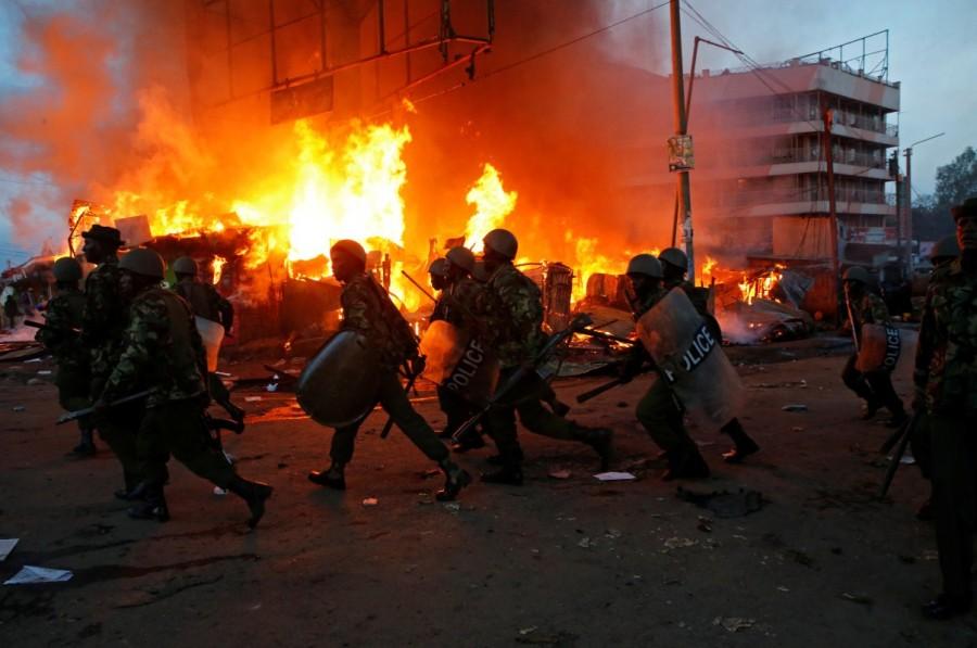 Anti riot police attempt to disperse rioters in Kawangware slums in Nairobi. Kenya's election re-run,Clashes at Kenya,Kenya election rerun,Tensions high in Kenya