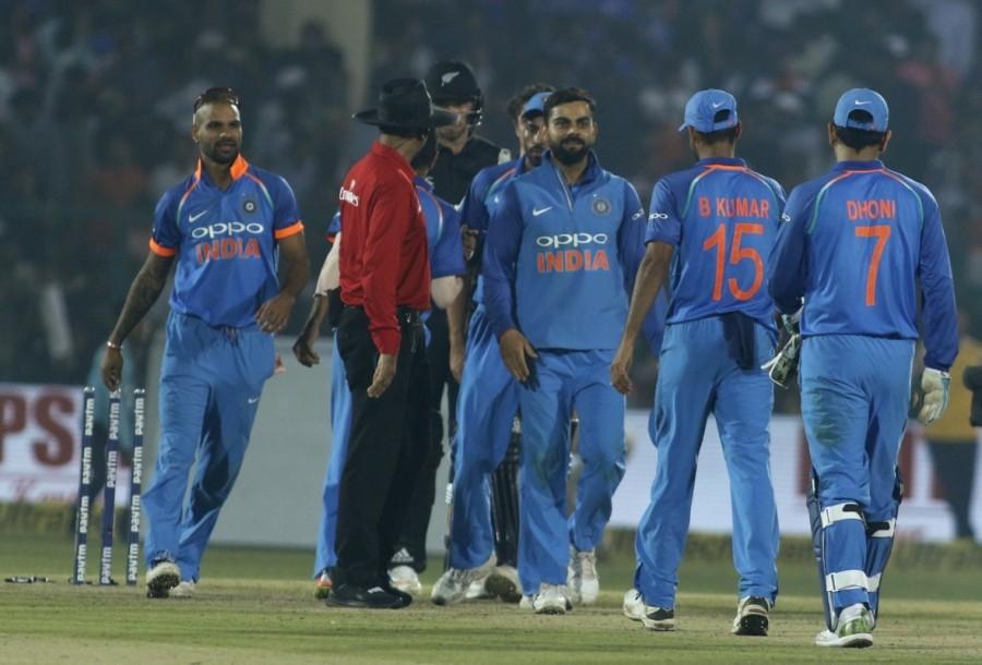 Bumrah struck the first blow for India when a miscued shot by Guptill saw Dinesh Karthik latch on to the catch at mid-off. It was the 50th ODI wicket for Bumrah, who is the second fastest Indian bowler to reach the landmark, completing the feat in 28 matches. Former pacer Ajit Agarkar holds the record at 23 matches. Munro and Kiwi skipper Kane Williamson then put together a partnership of 109 runs to put the visitors on a firm footing. Chahal broke the partnership when Munro was bowled after failing to read the turn. Munro, who was the highest scorer for the visitors, hit seven boundaries and three sixes during his 62-ball stay in the middle. Chahal claimed his second wicket four overs later, sending Williamson back to the pavilion. The Kiwis however, stayed firmly on course with Latham and Ross Taylor adding 79 runs between them off 76 deliveries. But the dismissals of Taylor and Henry Nicholls broke the visitors' momentum as the hosts made a strong comeback. India beat New Zealand,India vs New Zealand,India New Zealand,India beat New Zealand 3rd ODI,Virat Kohli,Jasprit Bumrah,Rohit and Kohli,Rohit Sharma
