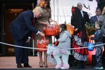 U.S. President Donald Trump (L) and first lady Melania Trump host Halloween at the White House on the South Lawn in Washington, DC. The first couple gave cookies away to costumed trick-or-treaters one day before the Halloween holiday.