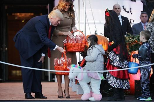 U.S. President Donald Trump (L) and first lady Melania Trump host Halloween at the White House on the South Lawn in Washington, DC. The first couple gave cookies away to costumed trick-or-treaters one day before the Halloween holiday.