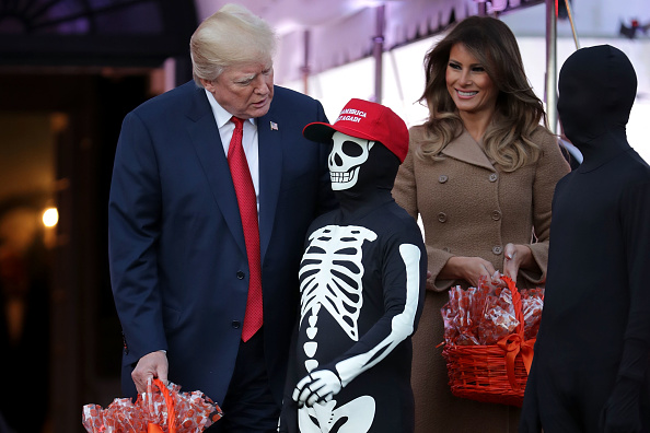 U.S. President Donald Trump (L) and first lady Melania Trump host Halloween at the White House on the South Lawn October 30, 2017 in Washington, DC. The first couple gave cookies away to costumed trick-or-treaters one day before the Halloween holiday. Donald Trump and Melania Trump,Donald Trump,Melania Trump,Halloween,Halloween 2017,Donald Trump celbrates Halloween,Melania Trump celbrates Halloween
