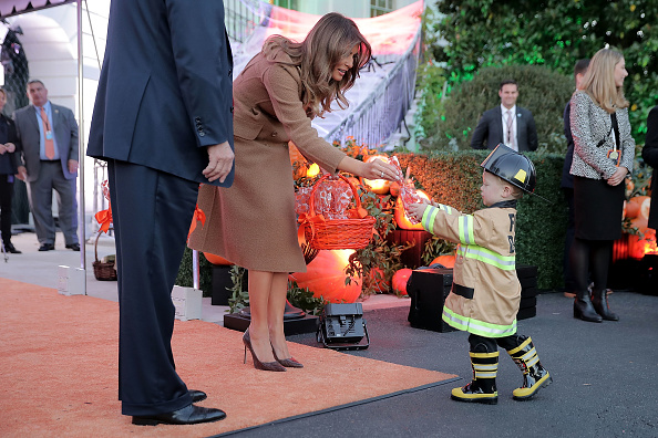 U.S. first lady Melania Trump gives a cookie to little trick-or-treater while hosting Halloween at the White House on the South Lawn October 30, 2017 in Washington, DC. The first couple gave cookies away to costumed trick-or-treaters one day before the Halloween holiday. Donald Trump and Melania Trump,Donald Trump,Melania Trump,Halloween,Halloween 2017,Donald Trump celbrates Halloween,Melania Trump celbrates Halloween