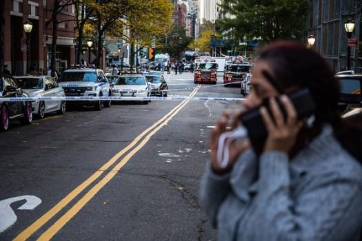 New York Fire Department (NYFD) and New York Police Department (NYPD) vehicles sit parked on a blocked off street after a motorist attack on the West Side of Manhattan in New York, U.S., on Tuesday, Oct. 31, 2017.