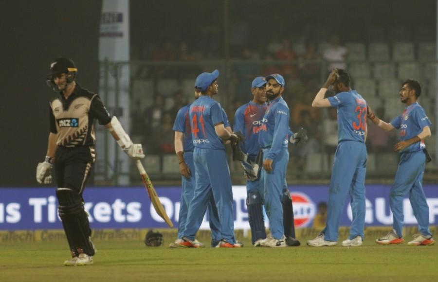 Dhawan's stay at the crease was ended when he failed to connect the ball and instead nicked back to stumper Latham. Two balls later, Sodhi packed the dangerous Pandya (0), who was promoted up to accelerate the scoring rate. With 3.2 overs left, skipper Virat Kohli (26 off 11 balls) walked into the middle amid loud cheers from the capacity crowd and began sending the bowlers to the leather hunt in the company of former skipper Dhoni, who was at 7 off two deliveries. After the match, Nehra took a lap of honour around the ground with the entire team with him. India thrash New Zealand,India beats New Zealand,Ashish Nehra,ashish nehra farewell,ashish nehra retirement match,Ashish Nehra retirement