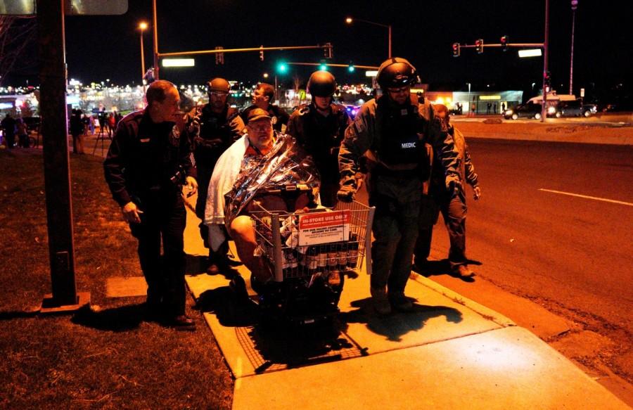 Patrick Carnes is evacuated in a Walmart cart by SWAT medics from the scene of a shooting at a Walmart where Carnes was shopping in Thornton, Colorado. Police are searching for a gunman who calmly walked into a Walmart in suburban Denver and opened fire with a handgun, randomly shooting at shoppers and store clerks, killing three people, before he fled. Colorado Walmart,Colorado Walmart shooting,casualties in Colorado Walmart shooting,Shooting at Colorado Walmart,suburban Denver