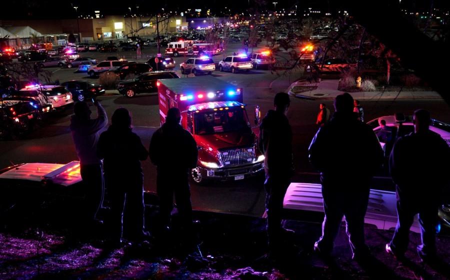 People watch an ambulance leave at the scene of a shooting at a Walmart in Thornton, Colorado. Colorado Walmart,Colorado Walmart shooting,casualties in Colorado Walmart shooting,Shooting at Colorado Walmart,suburban Denver