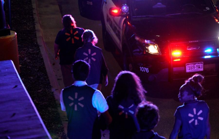 Walmart employees walk to a police staging area at the scene of a shooting at a Walmart in Thornton, Colorado. Colorado Walmart,Colorado Walmart shooting,casualties in Colorado Walmart shooting,Shooting at Colorado Walmart,suburban Denver