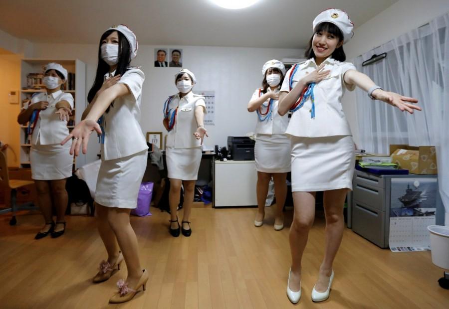 Chunhun (R), the leader of Japan's North Korea fan club called sengun-joshi, or military-first girls, and other members practice a Moranbong Band dance in Tokyo, Japan. North Korea fan club,North Korea,North Korea fan club in Tokyo