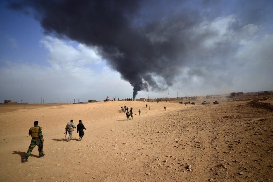 Shi'ite Popular Mobilization Forces (PMF) advance towards the city of Al-Qaim. Iraqi forces,Islamic State,Iraqi forces entered al-Qaim,al-Qaim,Islamic State militants