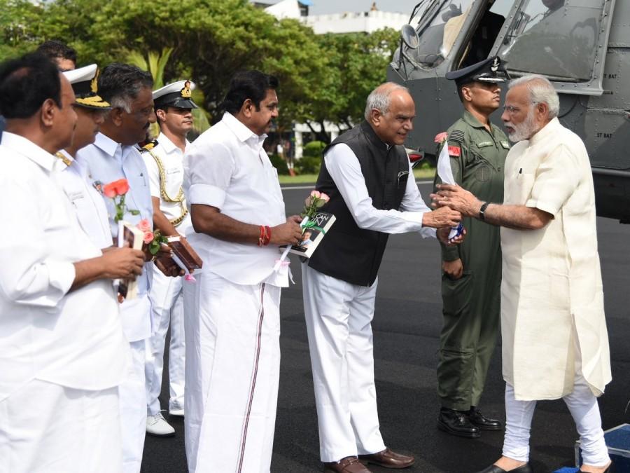 TN Guv Banwarilal Purohit welcomes PM Narendra Modi on his arrival at Chennai. Narendra Modi,Narendra Modi in Chennai,CM Edappadi K Palaniswami,O. Panneerselvam,TN Guv Banwarilal Purohit,PM Narendra Modi