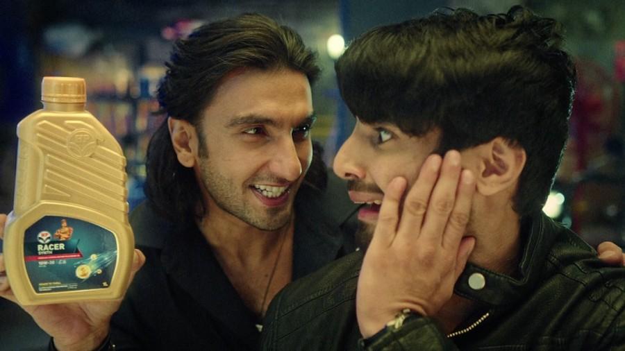 The commercial opens with a young biker riding into a garage and asking the mechanic to refill the engine oil in his bike. To this, the mechanic asks if he wants regular engine oil or HP Racer. The customer reacts indifferently saying he really doesn't care. Then enters Ranveer along with other mechanics, rapping the benefits of HP Racer. Ranveer Singh,actor Ranveer Singh,HP Lubricants' campaign,Ranveer Singh plays offbeat mechanic,Power to Thrill,Ranveer Singh plays an offbeat mechanic
