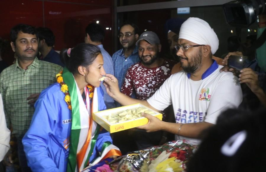 Indian women's hockey team arrives to grand welcome at T3 Airport. Indian women's hockey team,women's hockey team,T3 Airport,Indian women hockey team