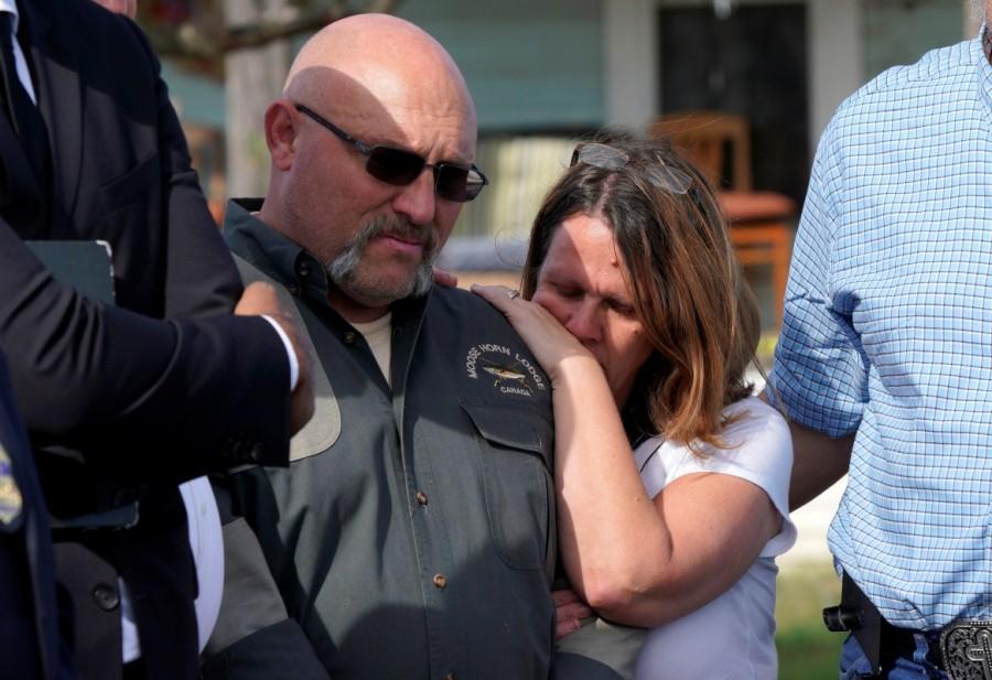Pastor Frank Pomeroy with his wife Sherri, listens at a news conference outside the site of the shooting at his church, the First Baptist Church of Sutherland, Texas, U.S., November 6, 2017. Mass shooting,Texas church,First Baptist Church,Texas church gunman Devin Kelley,Devin Kelley