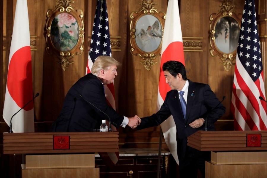 President Trump shakes hands with Japan's Prime Minister Shinzo Abe during a news conference at Akasaka Palace in Tokyo. Donald Trump,US President Donald Trump,Donald Trump president,Donald Trump in Asia,Donald Trump Asia trip,Donald Trump Asia visit,Donald Trump Asia tour