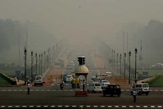 The national capital and its adjoining suburbs were blanketed in a grey haze on Wednesday morning, dipping visibility to 300 meters at some places, causing train delays and slowing down flight operations here. Some 30 trains coming to Delhi and 30 flights landing or taking off from the Delhi airport were delayed, according to officials.