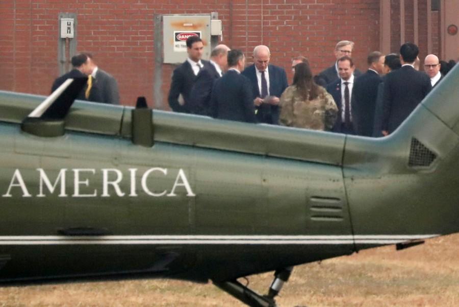White House Chief of Staff John Kelly (looking at notes) huddles with White House senior staff to discuss the situation at a U.S. military post in Seoul. Fog forces,President Trump,Trump,Donald Trump