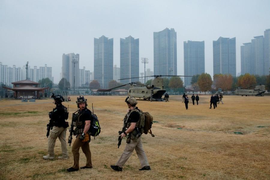 U.S. Secret Service counter-assault team members load up to travel by helicopter in the fog alongside President Trump's helicopter. Fog forces,President Trump,Trump,Donald Trump