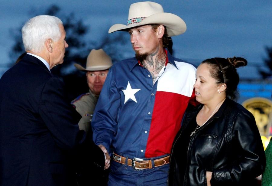 Vice President Mike Pence shakes hands with Johnnie Langendorff near the site of the shooting at the First Baptist Church of Sutherland Springs in Sutherland Springs, Texas. The gunman Devin Kelley managed to flee the scene in a getaway vehicle but shot himself to death and crashed in a ditch as Willeford and a passing motorist who was flagged down outside the church, Johnnie Langendorff, gave chase in Langendorff's pickup truck. Mike Pence,Vice President Mike Pence,Mike Pence pays tribute in Texas