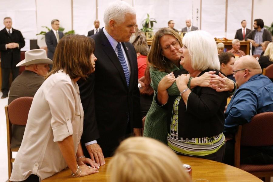 Vice President Mike Pence and his wife Karen (L) along with Sherri Pomeroy (2nd R) console a woman at Floresville high school. Pomeroy, wife of Pastor Frank Pomeroy, lost her daughter in the shooting. Pence was called upon to fill the role of America's "consoler-in-chief" in the absence of President Donald Trump, who has been out of the country on a state visit to Asia since before the shooting rampage. Mike Pence,Vice President Mike Pence,Mike Pence pays tribute in Texas