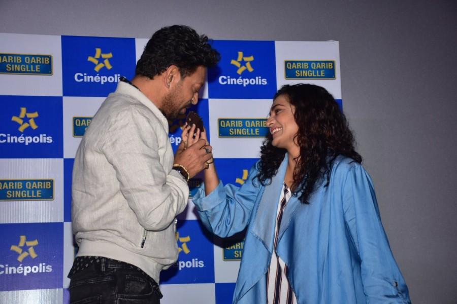 Parvathy said "Even I am very overwhelmed. Earlier also I have attended many first-day first shows and seen it with the audience and since nobody really recognizes me so it's very easy for me. But this time it was amazing to watch you guys responding to Jaya and Yogi. And he is not a different type of romantic guy, but actually, he should be the norm. He should be the common romantic hero for us. We can not find a better feminist, supportive, respectful, annoying Yogi. So thank you so much for watching us." Qarib Qarib Singlle,Irrfan Khan & Parvathy,Irrfan Khan,Parvathy