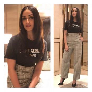 Yami recently dressed up in a retro attire and looked fabulous. She pulled off the high waist checkered pants that gave the retro look perfectly. Pairing up with a casual quoted t-shirt and black peep-toes, she completed the look with sheer elegance.