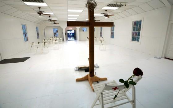 A chair and roses shows where Karla Holcombe was found dead at the First Baptist Church of Sutherland Springs.