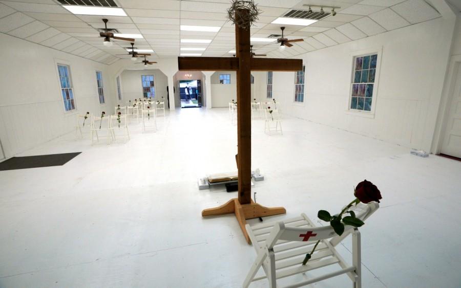 A chair and roses shows where Karla Holcombe was found dead at the First Baptist Church of Sutherland Springs. Texas church,Texas church reopens,Sutherland Springs,First Baptist Church