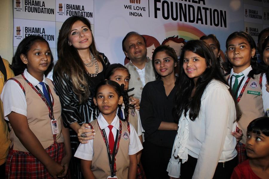 Kanika Kapoor, Asif Bhamla, Saher Bhamla and Sanya Bhamla with kids at Bhamla Foundation's Children's Day celebrations with spastic kids and kids from Duruelo Convent School, Bandra. Raveena Tandon,Kanika Kapoor,Asif Bhamla,Bhamla Foundation's Children's Day