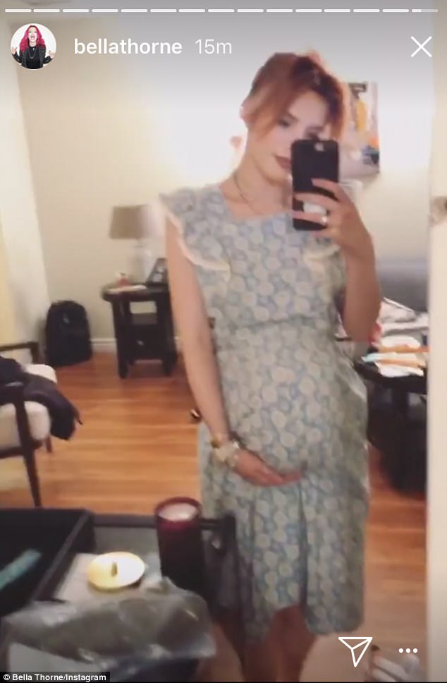 The actress can be seen donning a long dress in the video, while checking out her own reflection. Bella Thorne,Bella Thorne baby bump,Bella Thorne fake baby bump,Bella Thorne baby bump pics,Bella Thorne baby bump images,Bella Thorne baby bump stills,Bella Thorne baby bump pictures,Bella Thorne baby bump photos,Bella Thorne fake baby bump pics,Bella Th