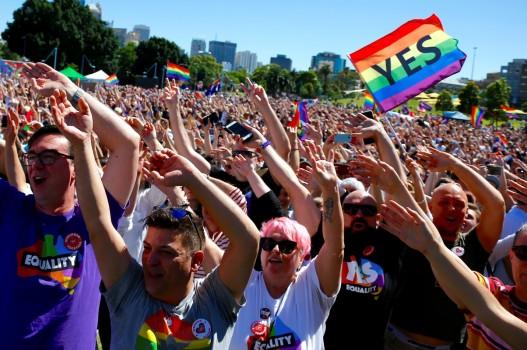 Supporters of the 'Yes' vote for marriage equality celebrate after it was announced the majority of Australians support same-sex marriage in a national survey, paving the way for legislation to make the country the 26th nation to formalize the unions by the end of the year, at a rally in central Sydney.