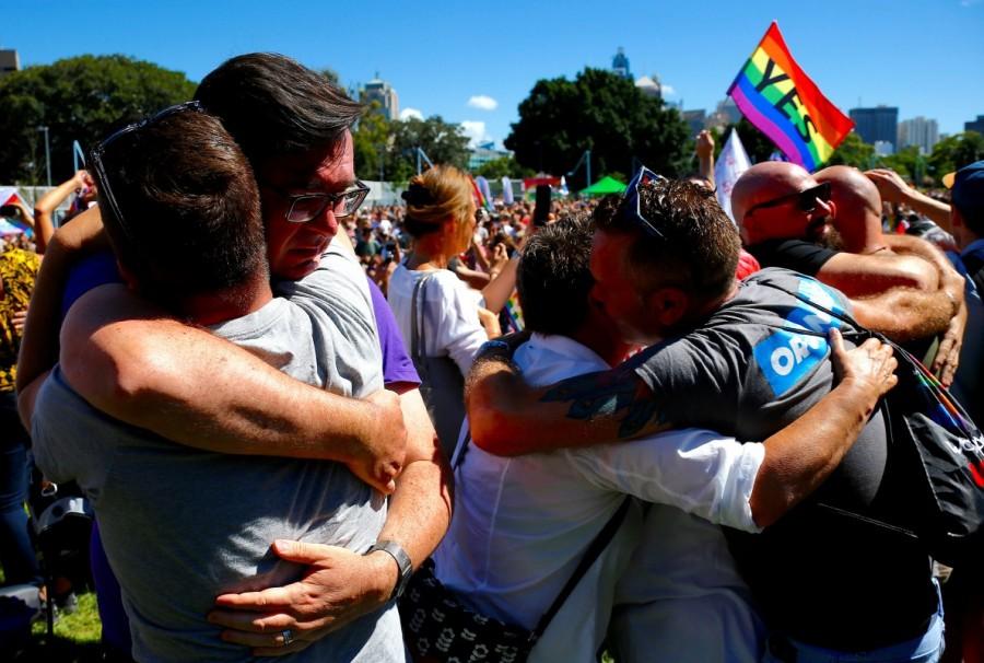 People celebrate at a rally in central Sydney. Same-sex marriage,same-sex marriage legalised,same-sex marriage Australia,Australians vote for same-sex marriage,vote for same-sex marriage