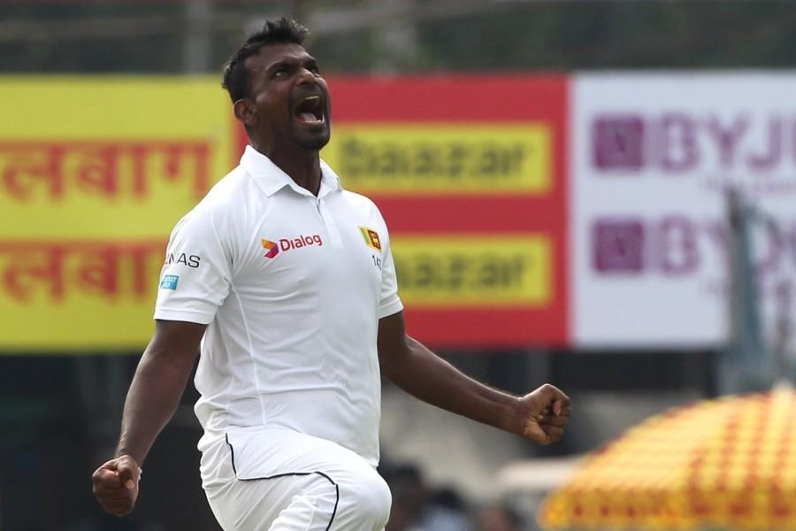 Saha got a reprieve when wicketkeper Niroshan Dickwella missed an easy stumping off Perera when he was batting on 25. With him was Jadeja who upped the ante hitting two fours and the first six of the innings before being lbw, a decision which the tourists reviewed after umpire Joel Wilson -- standing in place of indisposed Richard Kettleborough -- did not rule in favour of Dinesh Chandimal and Co. India vs Sri Lanka 2017,India vs Sri Lanka,India vs Sri Lanka first test,India vs Sri Lanka, 1st Test,Dilruwan Perera,Lahiru Gamage